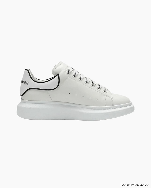 The minimalist style of McQueen white sneakers.
